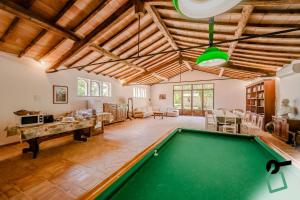 a pool table in the middle of a living room at Hotiday Grosseto Podere in Grosseto