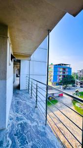 a balcony of a building with a view of a street at Backpackers Hub in Dimapur