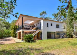 a large white house with a balcony at Begur "Casa es Pou" in Begur