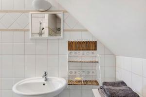 a bathroom with a sink and a mirror at Le Bourg Joly in Rigny-Ussé +71 photos