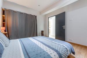 a bedroom with a bed and a large window at Mas Delorme 1 in Arles +16 photos