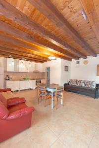 a large living room with a table and a couch at Cabana Diana in Avrig