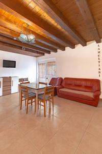 a living room with a table and a couch at Cabana Diana in Avrig +16 photos