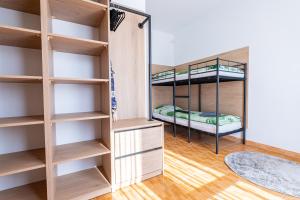 a room with two bunk beds in it at Pensjonat Perła in Grzybowo