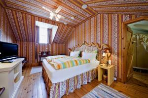 a bedroom with a bed and a television in it at The Dick Turpin Cottage in Clun