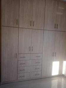 a large closet with wooden cabinets in a room at ARGOSTOLI sunset in Argostoli