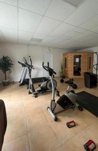 a gym with two exercise bikes in a room at Charmant chalet près d Albi et des vignobles in Rivières