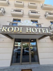 a hotel sign on the front of a building at Rodi Hotel Elbasan in Elbasan