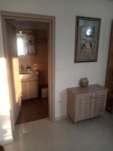 a small kitchen with a sink and a counter at ARGOSTOLI sunset in Argostoli +52 photos