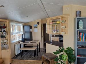a room with a kitchen and a dining room at The View in Millom