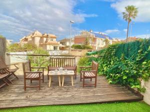 a patio with a table and chairs on a deck at Spanish Connection - Las Amoladeras in Cabo de Palos
