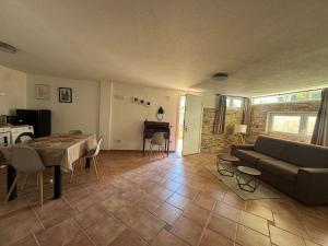 a living room with a couch and a table at Apulian Way in Torre Pelosa