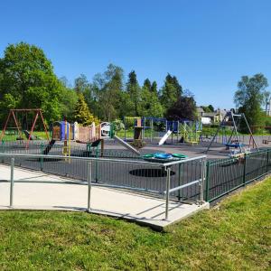 a park with a playground with slides and swings at Trivia House in Swanlinbar