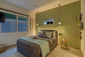 a bedroom with a bed and a window at Kalafatis Garden House in Itea