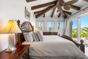 a bedroom with a bed and a ceiling fan at Palmilla Golf and Beach Villa in San José del Cabo +44 photos
