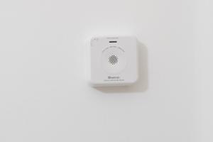 a white electronic device sitting on a white wall at ostuni In suite in Ostuni