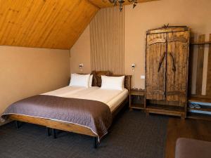 a bedroom with a large bed in a room at Silveroks Hotel in Bukovel