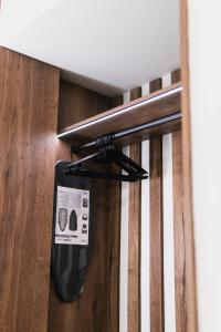 a metal rail in a stairwell with a trash can at Lighthouse Nest AXD in Alexandroupoli +6 photos