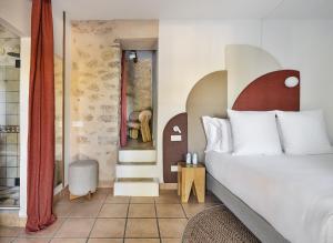 a hotel room with a bed and a bathroom at One Shot Buenavista in Santa Eularia des Riu +58 photos
