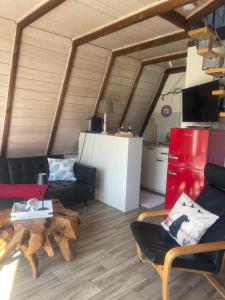 a living room with a couch and a table at Ferienhaus nähe Warnemünde 6 in Elmenhorst