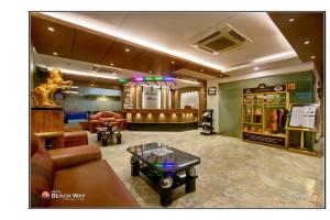ein Wohnzimmer mit Sofa und Tisch in der Unterkunft Hotel Beach Way in Cox's Bazar
