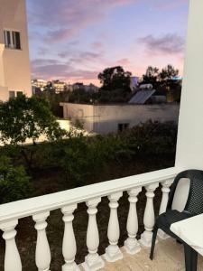 a balcony with a view of a sunset at Apartments Gigu in Ksamil +14 photos