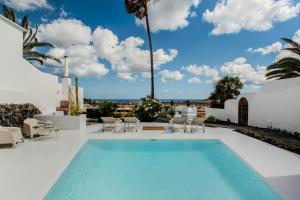 a swimming pool in a villa with a view at Villa Lore by Villalize in Teguise