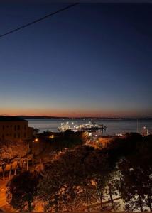 a view of a beach at night with a harbor at Kiraz Otel in Lapseki +17 photos