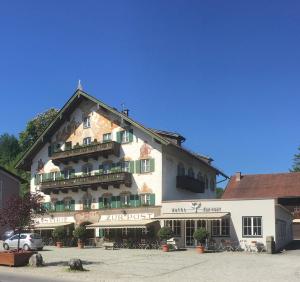 a large building with balconies on the side of it at Hotel zur Post in Kochel