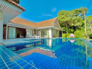 an image of a swimming pool in a house at Baan Golden Pool Villa in Sam Roi Yot