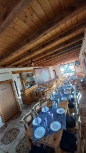 a room with a long table with blue plates on it at Konoba Taline Sokolac in Rešetnica