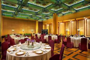 a banquet hall with tables and chairs and tablesktop at Sofitel Xi'an On Renmin Square in Xi'an +52 photos
