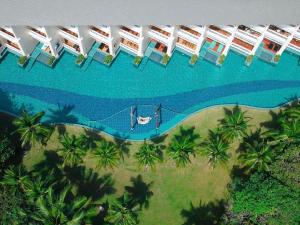 an aerial view of a resort with a swimming pool at Sofitel Krabi Phokeethra Golf and Spa Resort in Klong Muang Beach