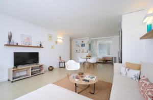 a living room with a couch and a tv at Beautiful Flat in Mont Choisy in Mont Choisy +22 photos
