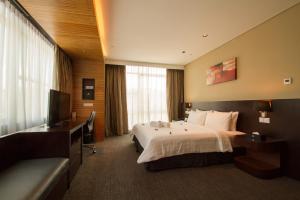 Postel nebo postele na pokoji v ubytování Grandis Hotels and Resorts