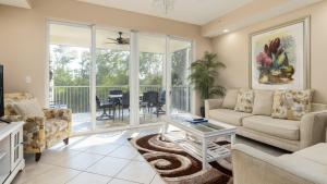 a living room with a couch and a table at 611 Mariners Club in Key Largo