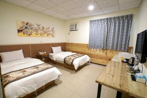Ένα ή περισσότερα κρεβάτια σε δωμάτιο στο Fuga Hotel