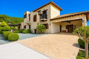 a house with a driveway in front of it at Villa River View in Peristerona