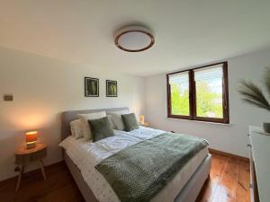 a bedroom with a bed and a window at Dom Skośna Kraśnik in Kraśnik