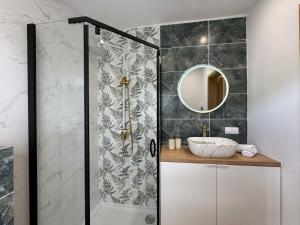 a bathroom with a shower with a sink and a mirror at Dom Skośna Kraśnik in Kraśnik +10 photos