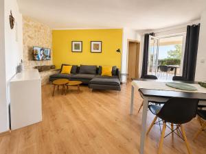 a living room with a couch and a table at Apartment MAGAŠ in Vrbnik
