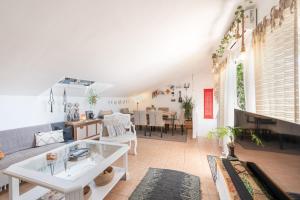 a living room with a couch and a table at Casa D’Amelia in Ojén