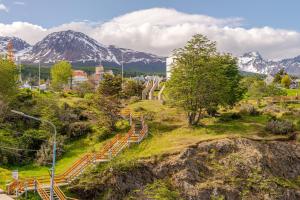 a group of stairs on a hill with mountains in the background at Kóor Stays - Australis in Ushuaia