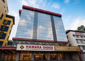 a building with a sign that reads hamara choco at Sabu's Grand Royale - Thampanoor in Trivandrum +21 photos