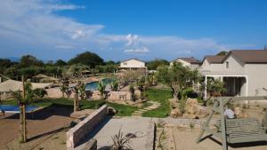 arial view of a house with a garden and a swimming pool at Ta Spitakia in Kos