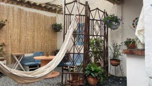 a hammock in the middle of a room at Taida Chalet - Glamping in Villa de Leyva +18 photos