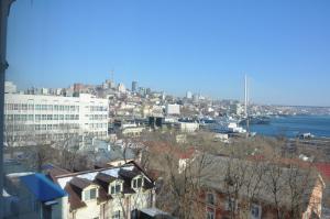 a view of a city with a river and buildings at Primorye Hotel in Vladivostok
