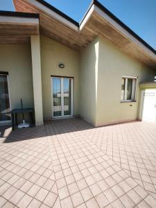 a patio of a house with a table at Camera matrimoniale - Villa Dalila in Silvi Paese +3 photos