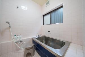 a bathroom with a sink and a toilet at 民泊ａｉｋｏ in Fukushima +93 photos