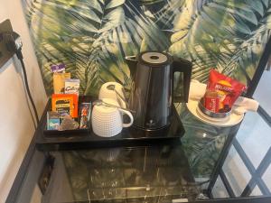 a coffee maker sitting on a table in a room at Wendys house in Sarisbury Green